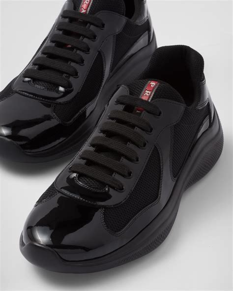 all black prada sneakers.